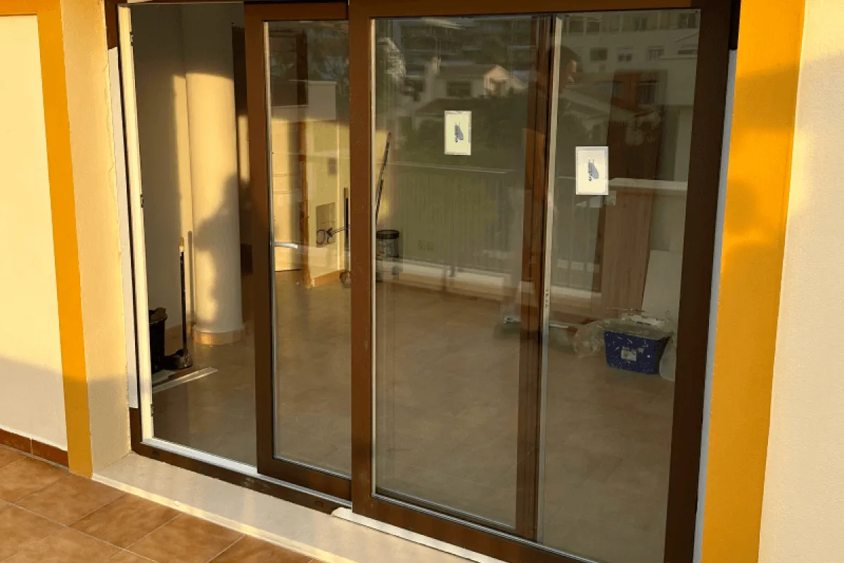 Walnut-finish sliding door for a terrace
