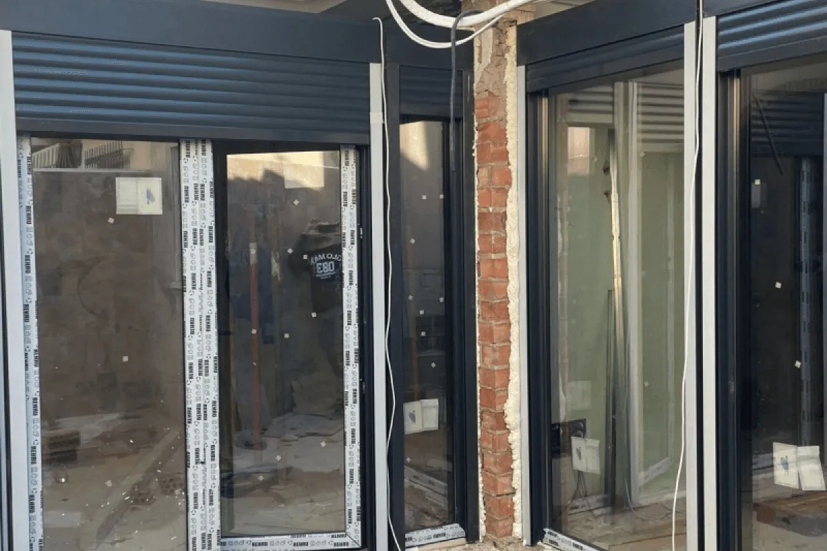 REHAU sliding units with shutters in a new build